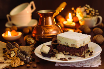 Still life on the table. Sweet cake and a hot drink .