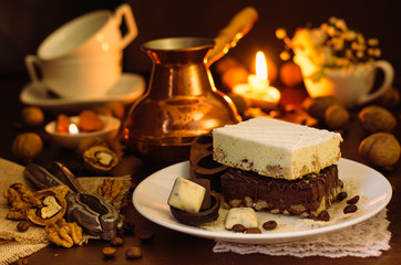 Still life on the table. Sweet cake and a hot drink .