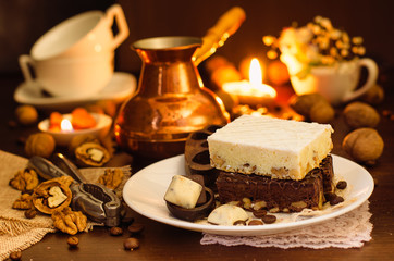 Still life on the table. Sweet cake and a hot drink .