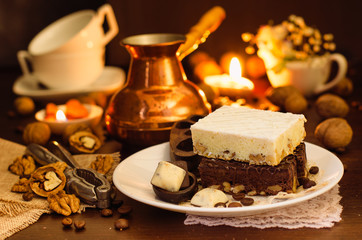 Still life on the table. Sweet cake and a hot drink .