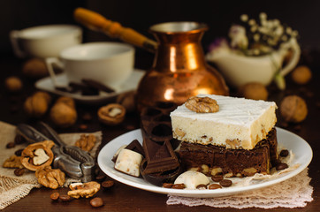 Still life on the table. Sweet cake and a hot drink .