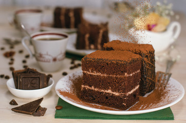 Still life on the table. Sweet cake and a hot drink . chocolate cake .