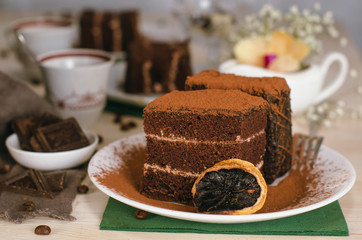 Still life on the table. Sweet cake and a hot drink . chocolate cake .