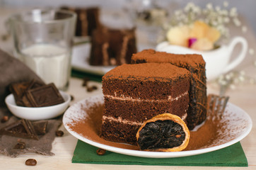 Still life on the table. Sweet cake and a hot drink . chocolate cake .