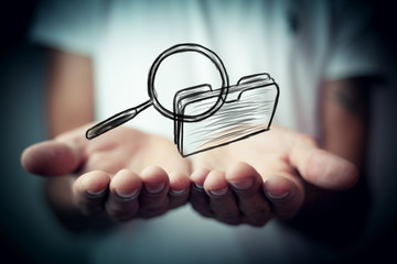 Outline icon of file folder and magnifying glass
