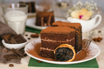 Still life on the table. Sweet cake and a hot drink . chocolate cake .