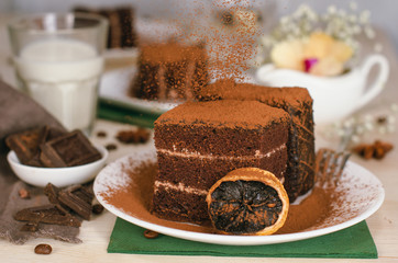 Still life on the table. Sweet cake and a hot drink . chocolate cake .