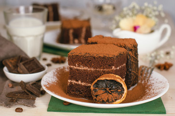 Still life on the table. Sweet cake and a hot drink . chocolate cake .