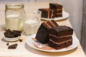Still life on the table. Sweet cake and a hot drink . chocolate cake .