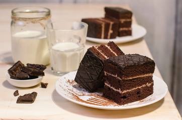 Still life on the table. Sweet cake and a hot drink . chocolate cake .