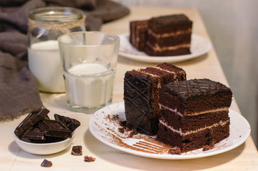 Still life on the table. Sweet cake and a hot drink . chocolate cake .