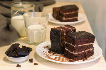 Still life on the table. Sweet cake and a hot drink . chocolate cake .