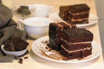 Still life on the table. Sweet cake and a hot drink . chocolate cake .