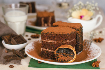 Still life on the table. Sweet cake and a hot drink . chocolate cake .