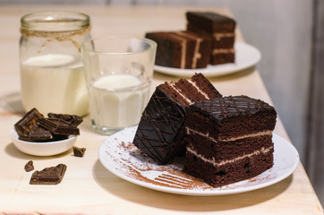 Still life on the table. Sweet cake and a hot drink . chocolate cake .