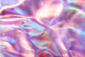 Abstract trendy holographic background in 80s style. Real texture in violet, pink and mint colors...