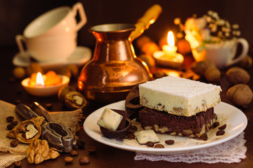 Still life on the table. Sweet cake and a hot drink .