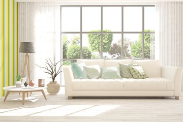 White stylish minimalist room with sofa and summer landscape in window. Scandinavian interior design. 3D illustration