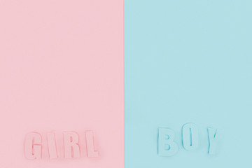 top view of boy and girl lettering on pink and blue background with copy space