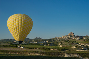 Fototapeta na wymiar Hot air yellow balloon in Cappadocia