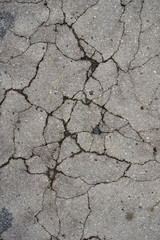 destructed tar road in a town