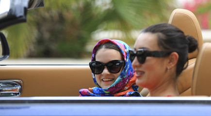 two girls in a cabriolet