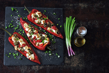Red peppers stuffed with feta and olives. Baked paprika with olives and white cheese. Vegetarian...