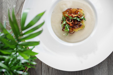 Appetizing exquisite soup cream with roasted cauliflower.