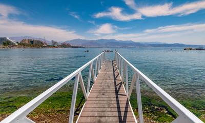 View on the Red Sea from swimming footpath at central public beach of Eilat - famous resort and recreational city in Israel and Middle East