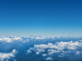 View of the sky and clouds from the airplane porthole