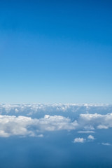View of the sky and clouds from the airplane porthole
