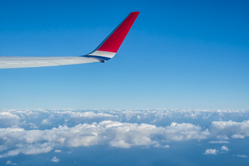 View of the sky and clouds from the airplane porthole