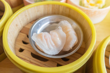 Fototapeta na wymiar shrimp Dim Sum dumplings in bamboo basket