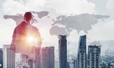 Concept of business success and control with confident boss against cityscape background