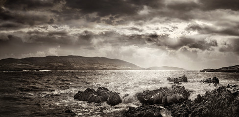 Panoramic evening landscape with cloudy sky and rocks in County Cork