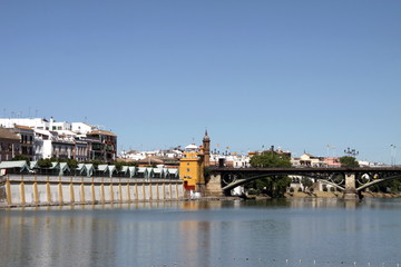 View of the Guadalquivir River and the Isabella II Bridge in Seville