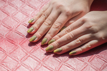 Bright golden green manicure. Spring ideas for women, beauty and care for hands and nails	 