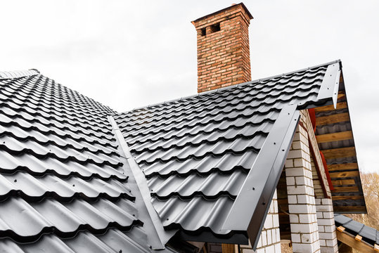 Construction Of The Roof Of The House. Metal Tiles.