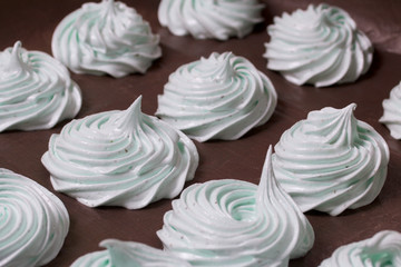 Freshly prepared marshmallows are laid on a flat surface to set.