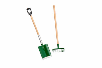 Small gardening rake and shovel isolated on white background