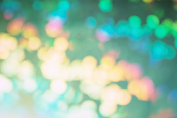 Obraz premium On a dark green background, bright spots in blur. Blank abstract background for layouts. Lights in defocus.