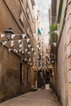 Perspective view of the narrow street in the Gothic Quarter, Barcelona, Spain