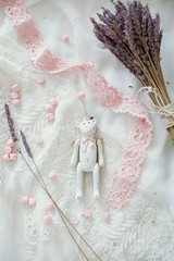 wooden teddy bear, sweets and bouquet of lavender