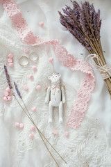 wooden teddy bear, sweets and bouquet of lavender