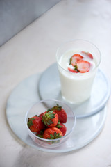 Strawberry homemade yogurt with fresh strawberries on white table