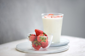 Strawberry homemade yogurt with fresh strawberries on white table