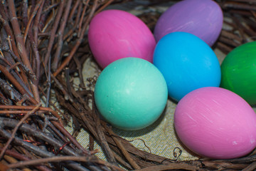Fototapeta na wymiar Colorful easter eggs in the nest. Close-up.