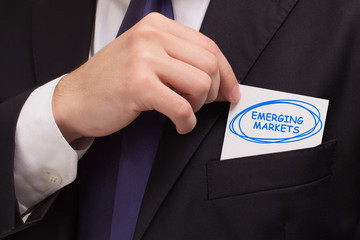 Business, technology, internet and networking concept. Young entrepreneur showing keyword: Emerging...