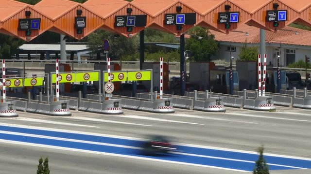 Scene of traffic in motion in a toll of C-32 freeway in "Arenys de mar", province of Barcelona. Time Lapse. Long exposure.