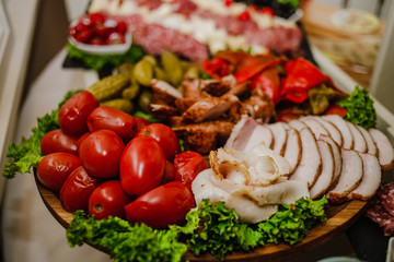 Delicious snacks with bacon, tomatoes, cucumbers and bread